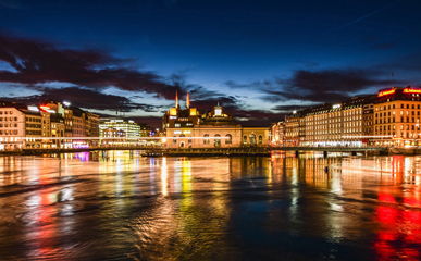chauffeur service geneva genf View across Lake Geneva to Geneva in the evening light.