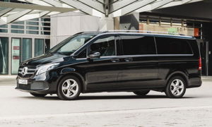 A black mercedes Benz luxury van.