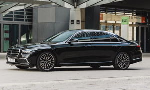 A black mercedes s class limousine.